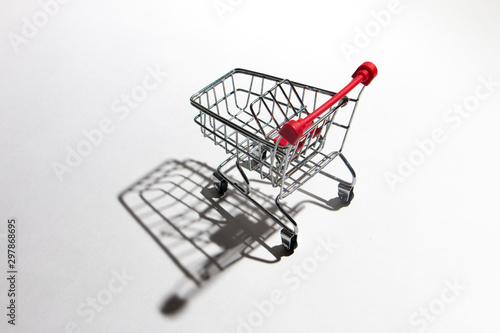 Empty shopping trolley isolated on white, closeup