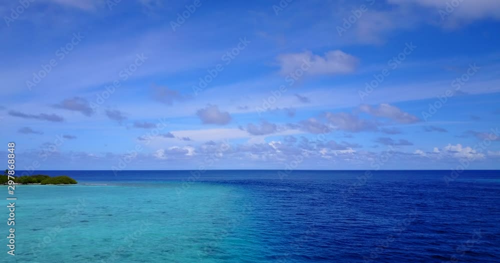Hovering above a gradient of shallow to deeper tropical ocean in the Caribbean Hovering above a gradient of shallow to deeper tropical ocean in the Caribbean