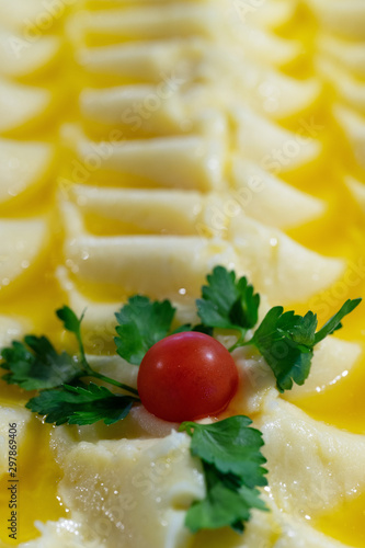 Tomato closeup on mashed potatoes. Vegetarian diet