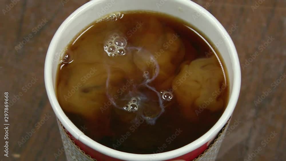 Slow Motion Cream Swirling In Coffee Close Up - 120 fps Slow Motion Cream Swirling In Coffee Close Up - 120 fps