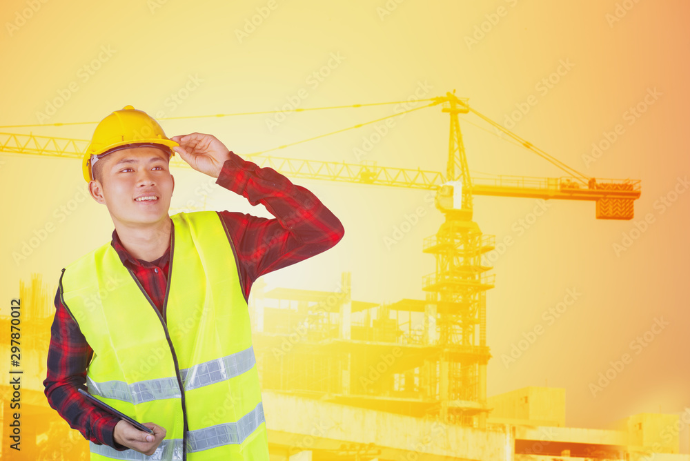 Young man architect on a building construction site. Young man architect on a building construction site.
