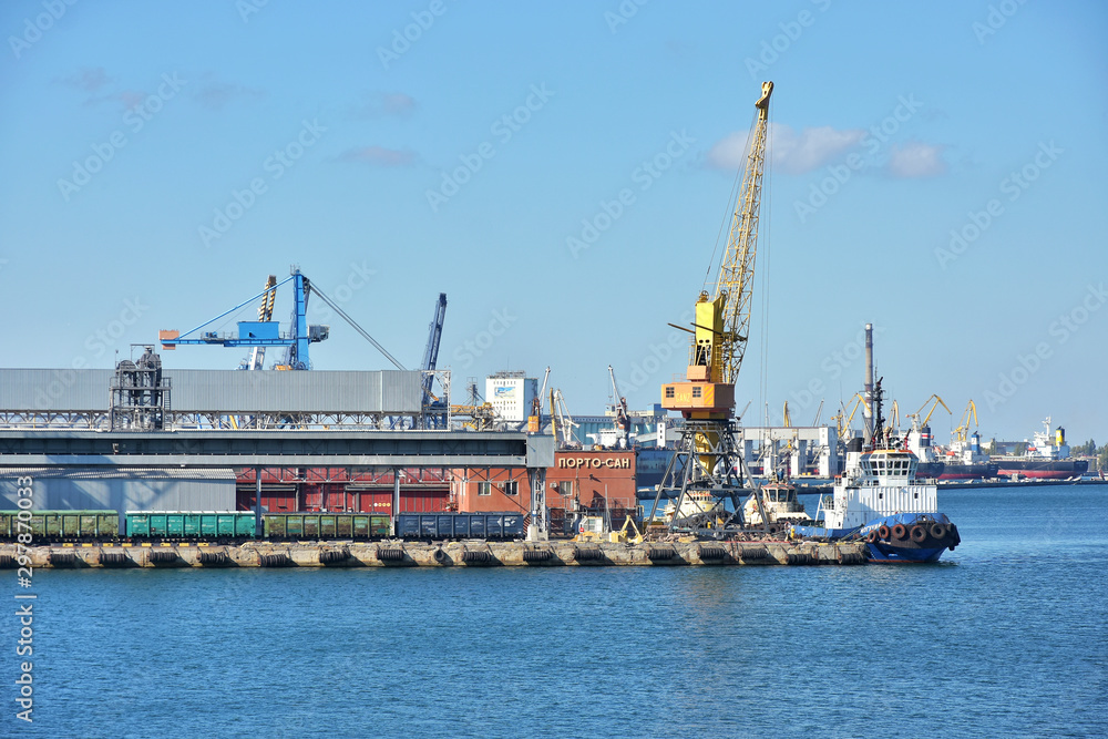 Odessa, Ukraine - October 2019. Odessa Trade Port the largest ports in the Black Sea. Cargo port with working harbor cranes with sea surface on front, selective focus. 