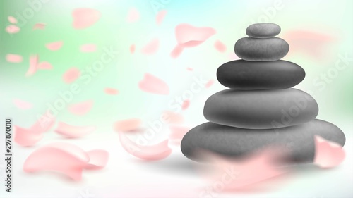 Tower of stones and pink petals  massage and spa  oriental medicine  harmony and meditation