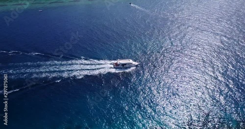 Wallpaper Mural Luxury Yacht Sailing on Vibrant Clean Tropical Ocean with water reflection, Tahiti Torontodigital.ca