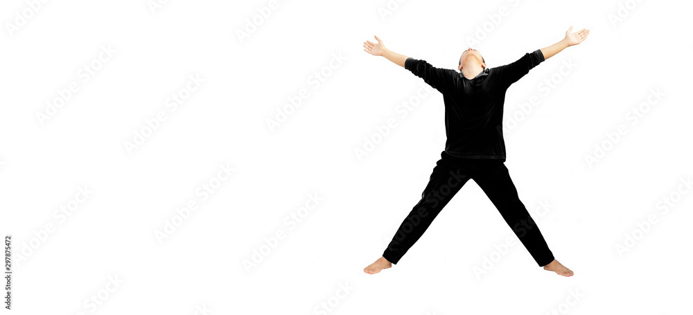 Full-length shot of male teenager doing stretching exercises isolated on white by spreading his hands wide enough in the air. Male doing active exercise. Active male pose.