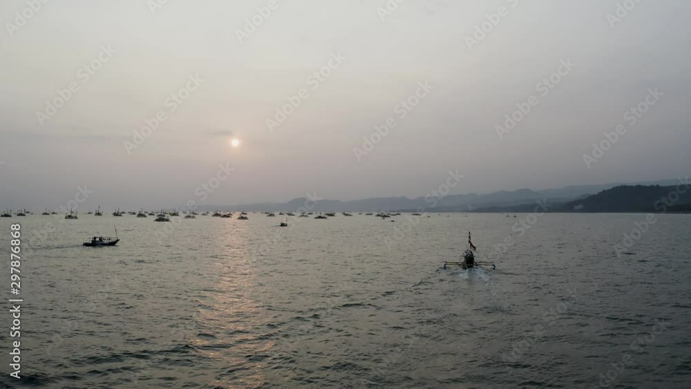 Dramatic aerial of fishing boat on open water, Indonesia, Circle Pan Dramatic aerial of fishing boat on open water, Indonesia, Circle Pan