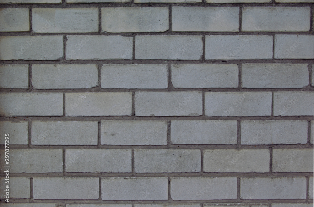Close up full frame gray brick wall, ideal background or texture at the afternoon Close up full frame gray brick wall, ideal background or texture at the afternoon