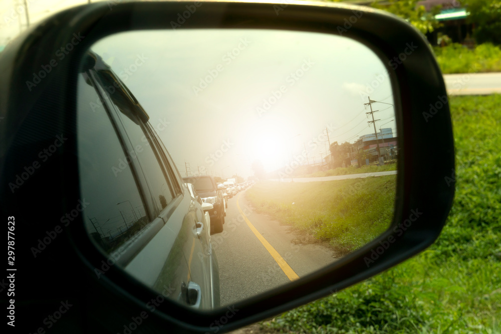 Inside car on Side view mirror for trip to travel or traffic jam at upcountry.