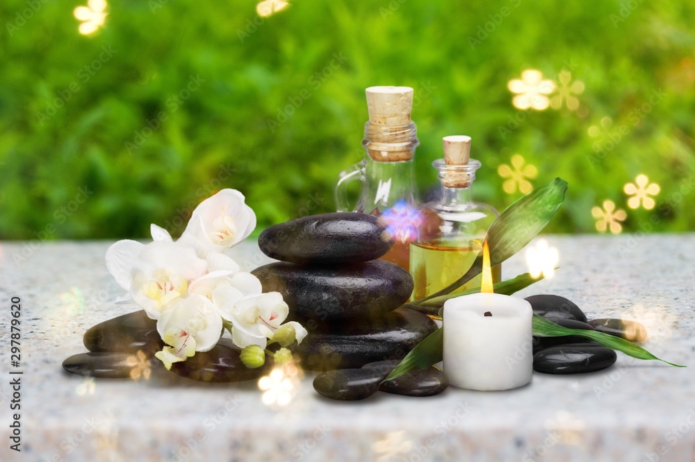Zen basalt stones and aroma oil on the white Zen basalt stones and aroma oil on the white