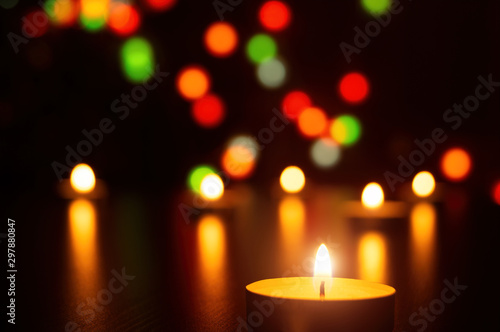 Christmas Candles flame light romantic decoration in defocused lights