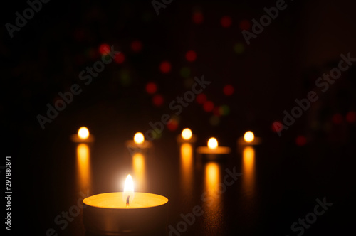 Christmas Candles flame light romantic decoration in defocused lights