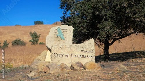 Zoom out shot of the Welcome City of Calabasas, on a field near to a single tree. Home of the Kardashians.  Rich and Famous photo