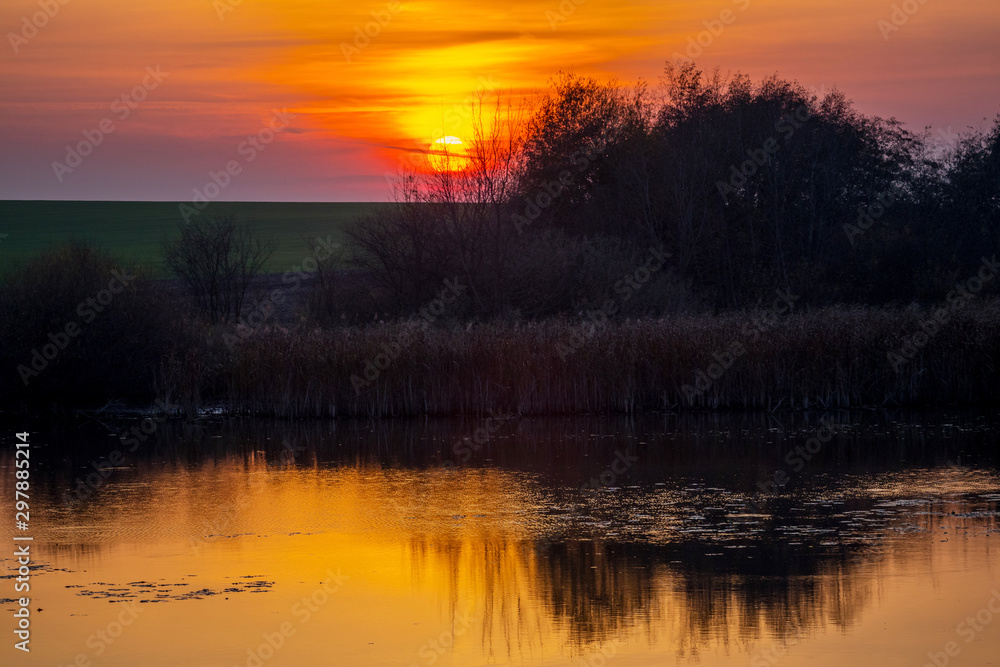 Picturesque landscape: sunset over the river_