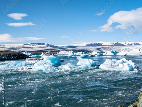 Panorama of Jokulsarlon glacier and icebergs floating in the lagoon, one of the most touristic spots in Iceland.