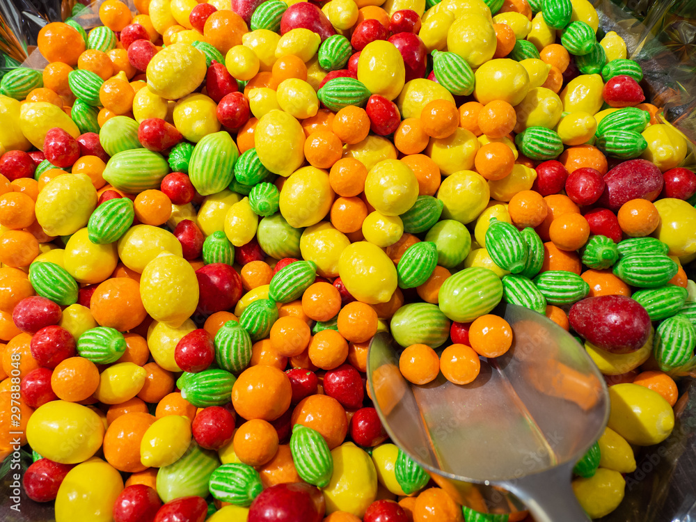 Close up of bowls filled with a large selection of different colored soft candies Close up of bowls filled with a large selection of different colored soft candies