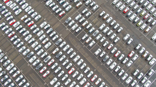 TOP DOWN: Flying above a massive car park full of new vehicles ready for export.