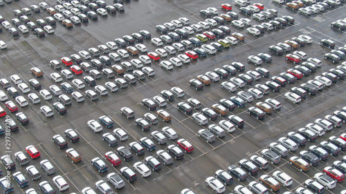 Fotografie AERIAL: Flying above a massive parking lot in harbor full of newly imported cars