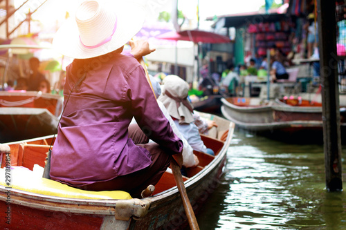 Grocers rowing boats in the floating market photo