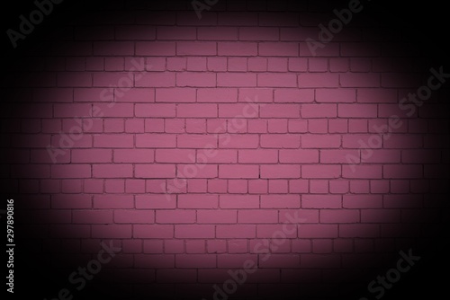 Pink brick wall with strong vignette.