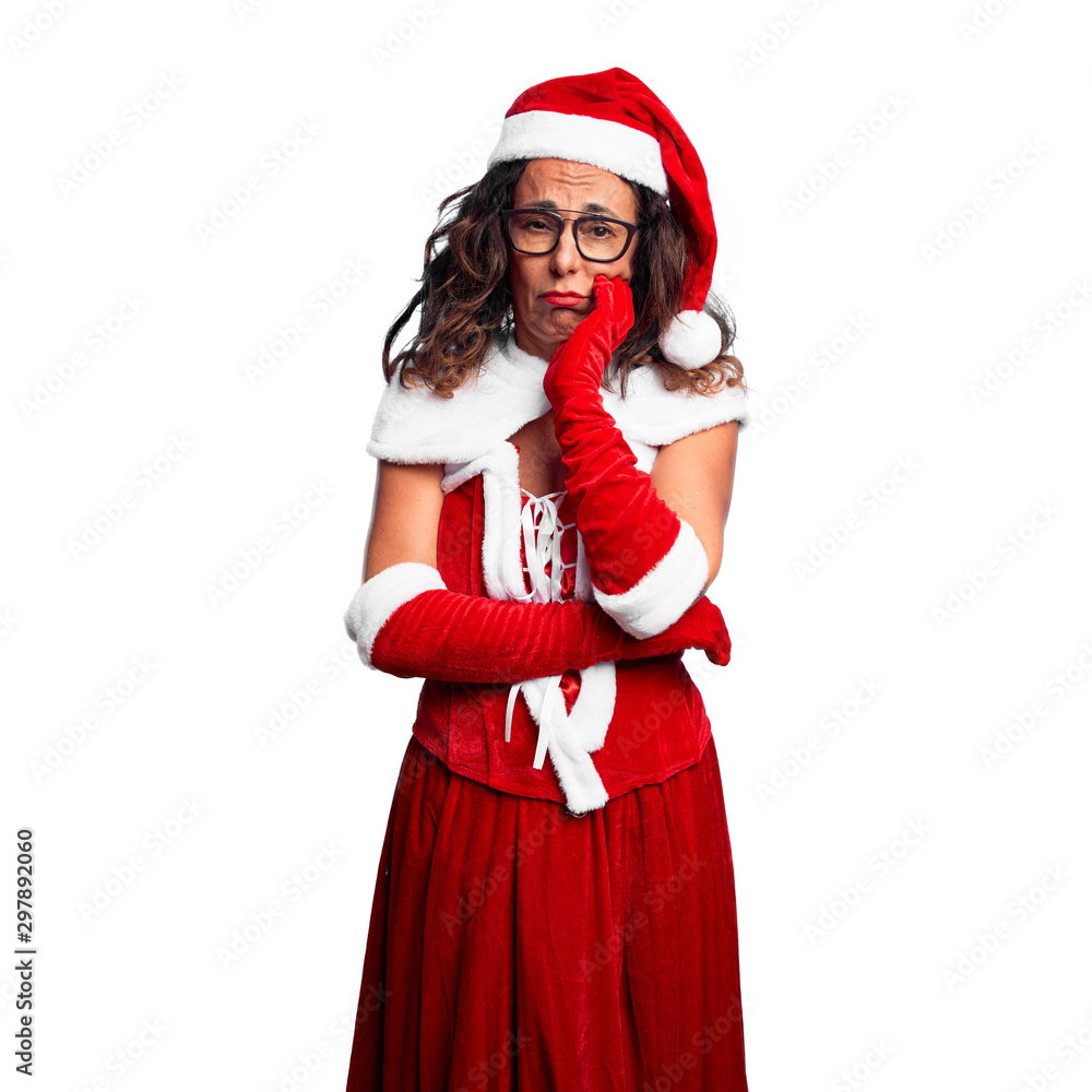 Middle age woman wearing Santa Claus costume thinking looking tired and bored with depression problems with crossed arms. Middle age woman wearing Santa Claus costume thinking looking tired and bored with depression problems with crossed arms.