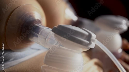Mother is breast pumping baby photo