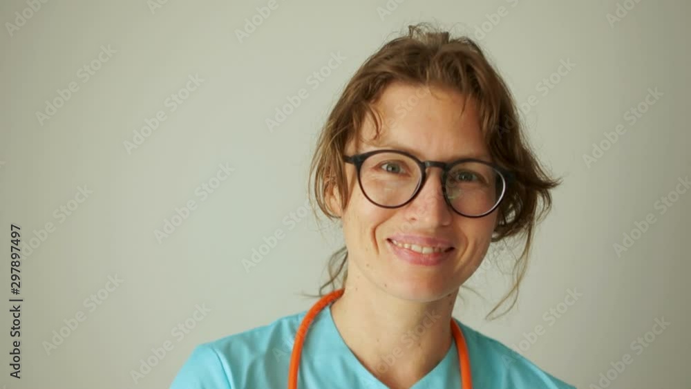 Doctor therapist woman with glasses, close portrait, woman smiling. Medicine and healthcare concept Doctor therapist woman with glasses, close portrait, woman smiling. Medicine and healthcare concept