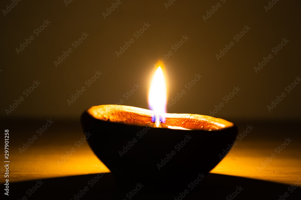 Diya illuminated for Diwali festivities