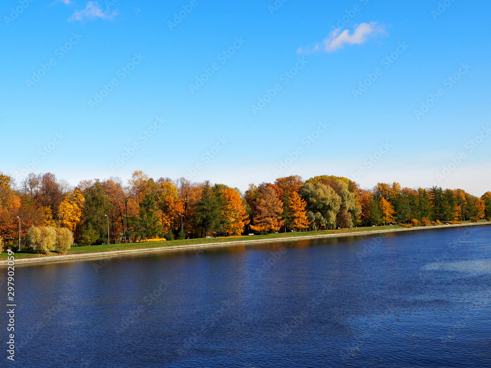 autumn landscape - bright colorful autumn forest along a wide river