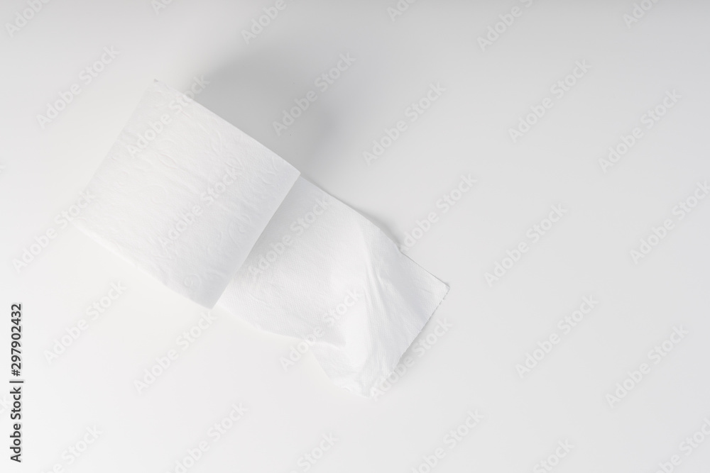 Opened roll of toilet paper on a white table. Hygiene concept Opened roll of toilet paper on a white table. Hygiene concept