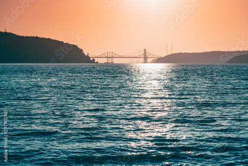 Reflection off the amazing Carquinez Strait with the Bridges in the background during sunset photo