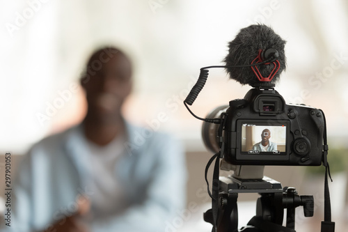 Εκτύπωση καμβά Close up professional camera filming young smiling african american speaker