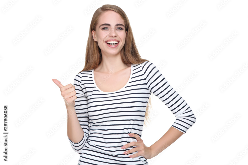 Young beautiful girl showing thumb up on white background Young beautiful girl showing thumb up on white background