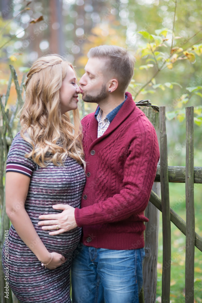 Fototapeta premium A portrait of young married couple expecting a baby