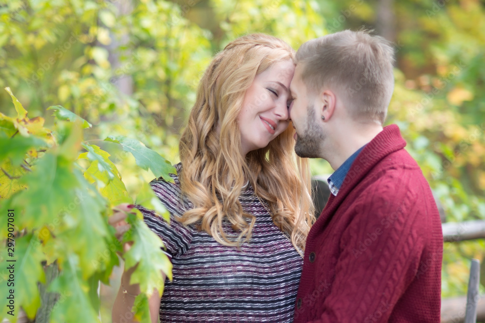 A portrait of young married couple expecting a baby A portrait of young married couple expecting a baby