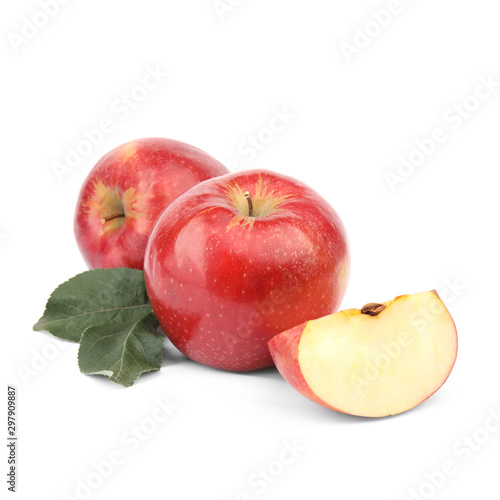 Ripe juicy red apples with leaf on white background
