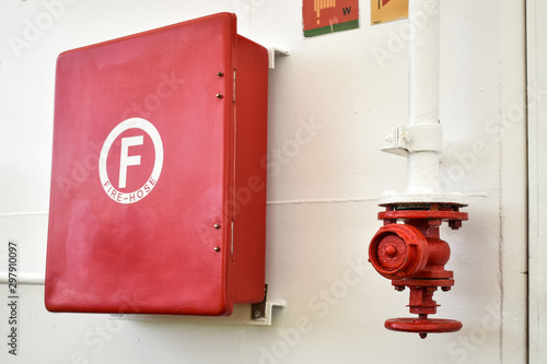 Red fire hose cabinet and fire hose connector - hydrant