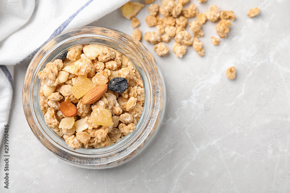 Tasty homemade granola on light table, top view with space for text. Healthy breakfast Tasty homemade granola on light table, top view with space for text. Healthy breakfast