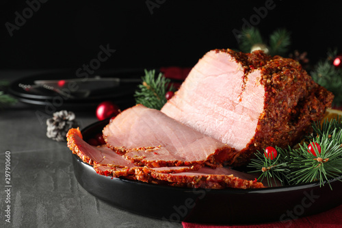Tray with delicious ham on grey table. Christmas dinner