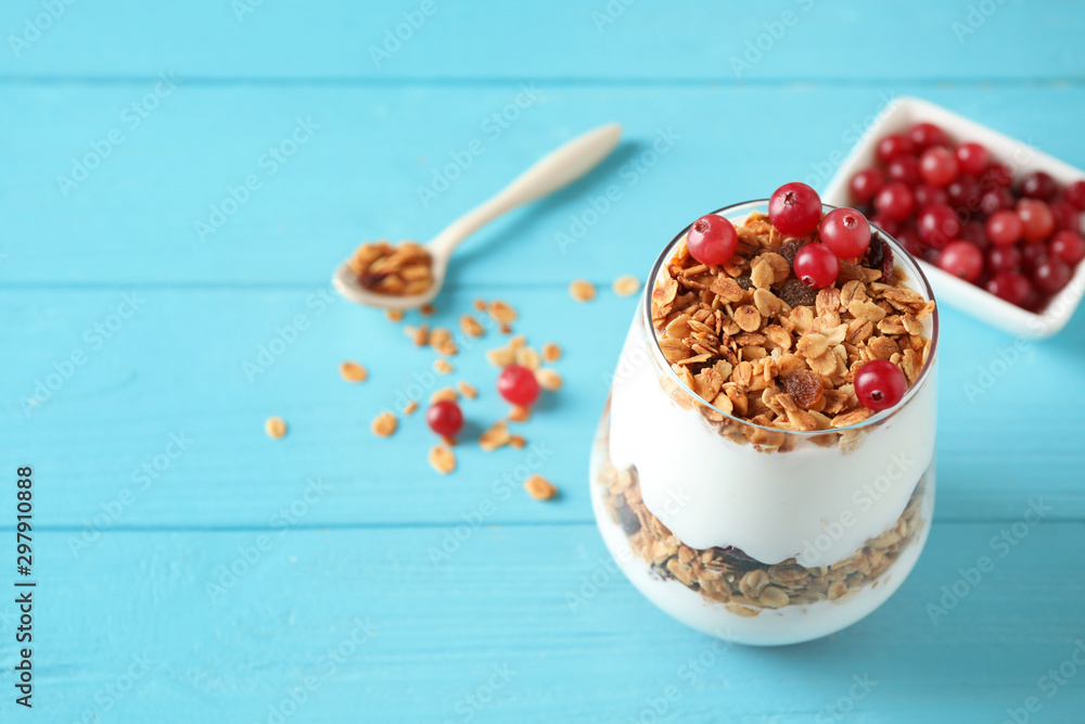 Tasty homemade granola served on blue wooden table, space for text. Healthy breakfast Tasty homemade granola served on blue wooden table, space for text. Healthy breakfast