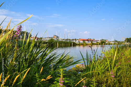 Fototapeta Naklejka Na Ścianę i Meble -  Marina in Gizycko on Lake Niegocin with moored boats. View from the breakwater. Gizycko, Mazury, Poland.