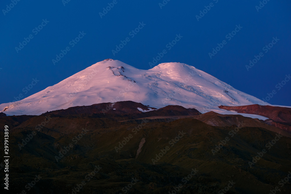 Dawn over the snowy peaks of Mount Elbrus. North Caucasus.