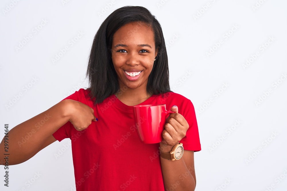 Young african american woman drinking a cup of coffee over isolated background with surprise face pointing finger to himself Young african american woman drinking a cup of coffee over isolated background with surprise face pointing finger to himself