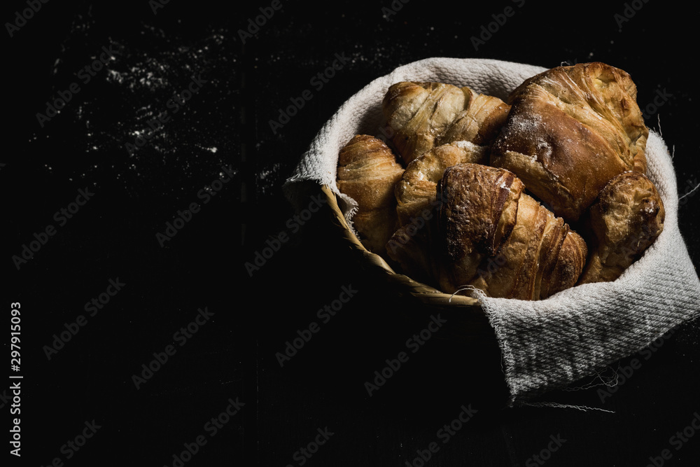 Fototapeta premium fresh cheese bread on black background and flour
