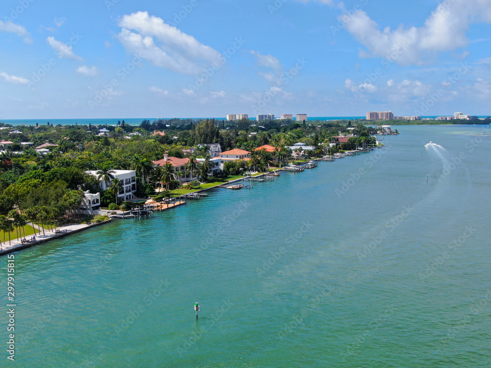 Fototapeta premium Aerial view of Bay Island neighborhood and luxury villas next the ocean, in Sarasota, Florida, USA