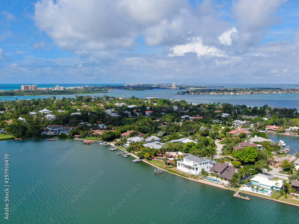 Fototapeta premium Aerial view of Bay Island neighborhood and luxury villas next the ocean, in Sarasota, Florida, USA