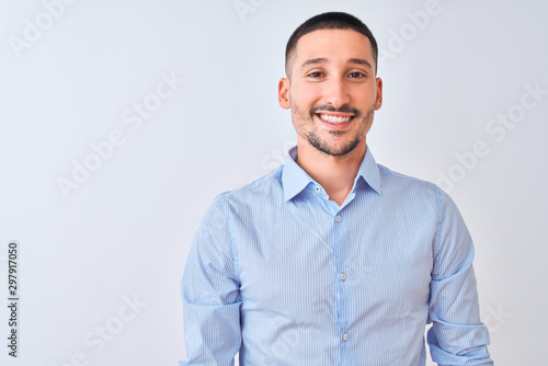 Young handsome business man standing over isolated background with a happy and cool smile on face. Lucky person. © Krakenimages.com