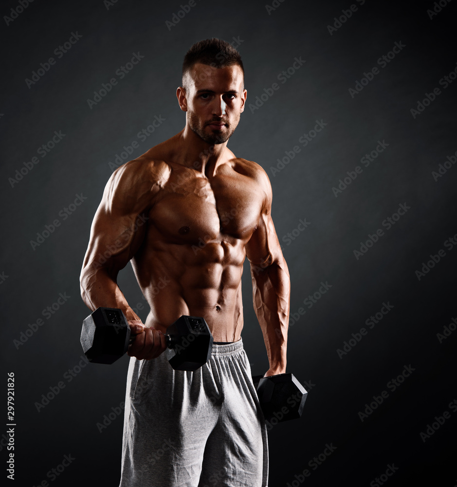 Muscular Men Lifting Weights. Studio Shot