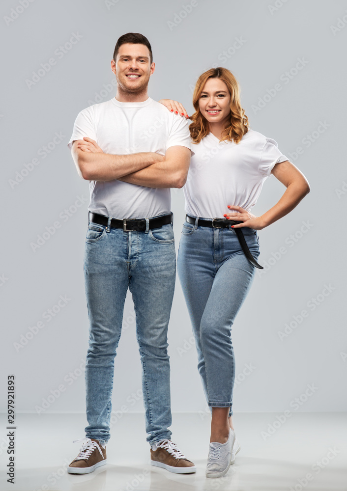 relationships and people concept - portrait of happy couple in white t-shirts over grey background relationships and people concept - portrait of happy couple in white t-shirts over grey background