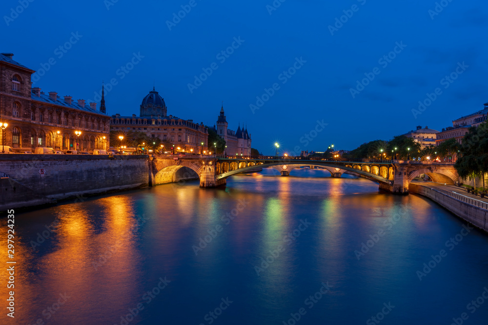 Conciergerie and Seine river in Paris at dusk