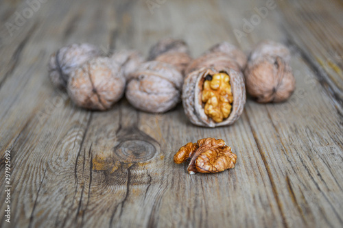 Walnuts closeup on a wooden background, selective focus